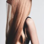 Long straight hair elegantly cascading down the back