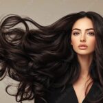 Luxurious dark hair flowing with curls